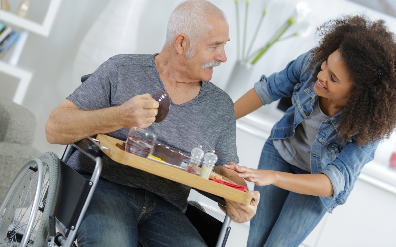 positive woman takign care of her ill grandfather positive woman takign care of her ill grandfather
